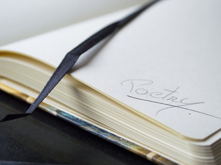 note book with the word Poetry written