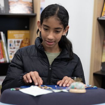 Girl looking at heritage documents