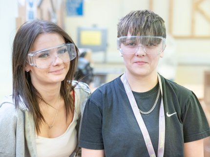 Two Inspire College learners in safety goggles.
