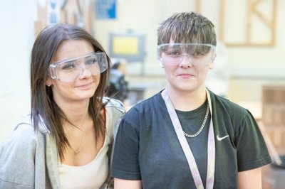 Two Inspire College learners in safety goggles.