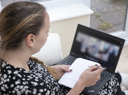 student working at home with laptop hands.jpg