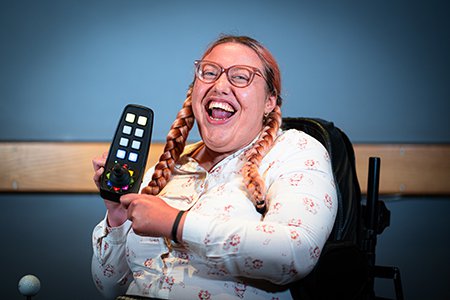 Headshot image of AO Pioneer, Jess holding a CMPSR digital instrument
