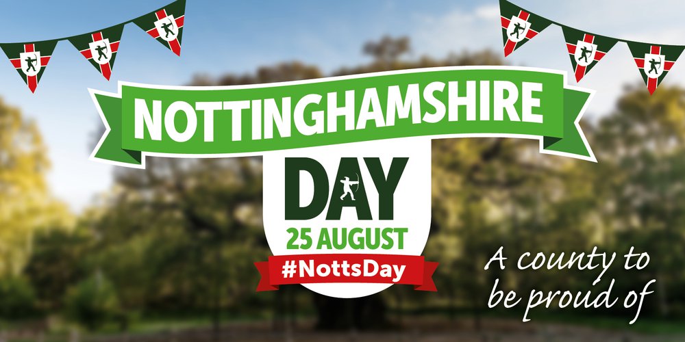 The Nottinghamshire flag with a green background, red cross and silhouette of Robin Hood